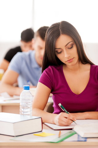 http://www.dreamstime.com/stock-images-confident-student-beautiful-female-writing-something-note-pad-sitting-classroom-other-students-image39498884